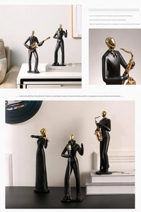 Détail de figurines de musiciens abstraits modernes noirs et dorés au fini mat