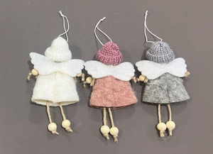 Detail of handmade knit angel ornaments in white, pink, and grey with felt wings and wood beads