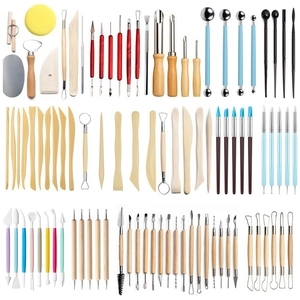 Complete clay sculpting tool set with wooden and metal carving knives on white background