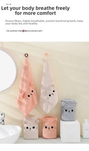 Close-up of coral fleece hair drying towels with cute embroidered cat faces