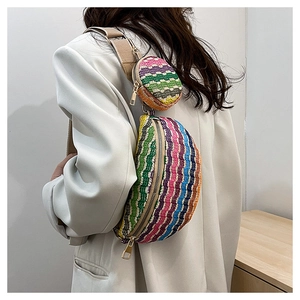 Detail showing colorful striped woven straw fanny pack with a small round coin purse