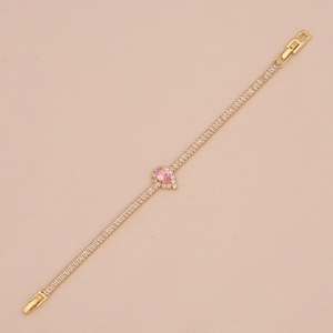 Detail of pink pear-cut zircon bracelet with golden plating and tennis chain design