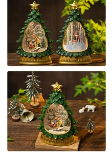 Macro detail of Christmas tree snow globe showing Santa on a sleigh with warm LED lighting