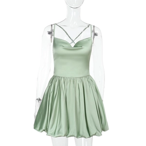 Sage green satin backless slip dress with cross straps and tiered flowy skirt