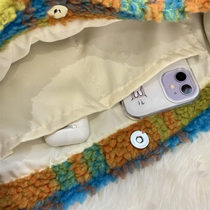 Detail of colorful plush tote bag interior featuring magnetic snap pocket and storage space