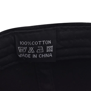 Detail of 100% cotton washing label and stitching on black Texas baseball cap
