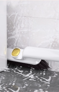 Rotating crevice brush for bathroom corners with hard bristles and ergonomic handle