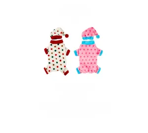Close-up of polka dot plush pet pajamas and matching hat set in soft coral fleece