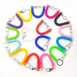Colorful spiral spring keychain cords with metal rings in a vibrant circular array