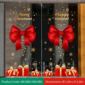 Detail der Weihnachtsfensterbilder mit roten Schleifen und Geschenkboxen für Glastüren