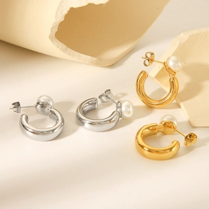 Elegant gold and silver C-shaped stainless steel hoop earrings with white pearls