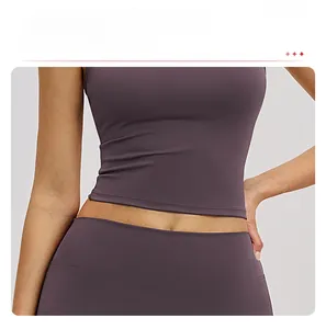 Detail of high-elasticity dark purple yoga top featuring a slimming waist fit and smooth fabric