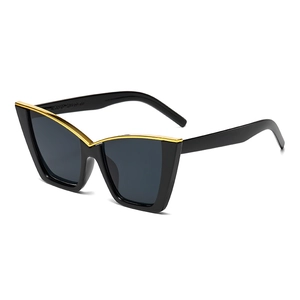 Fashion cat eye sunglasses in black with gold metal trim and dark grey lenses