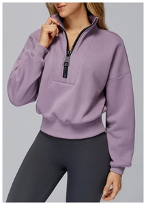 Detail of lavender half-zip sweatshirt showing stand collar and ribbed cuffs for women