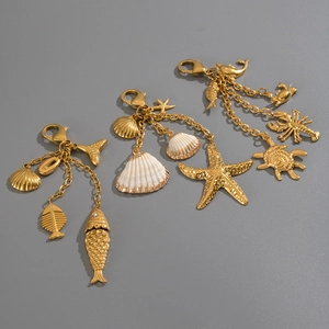 Macro view of ocean themed charms featuring starfish and golden sea life details