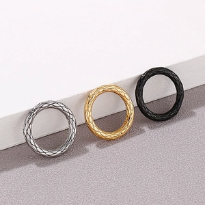 Three-piece stackable titanium steel rings with diamond lattice pattern in gold, silver, and black