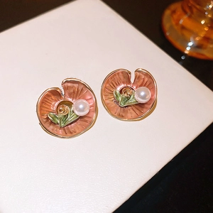 Elegant pink enamel lotus leaf stud earrings with white pearl center and gold accents
