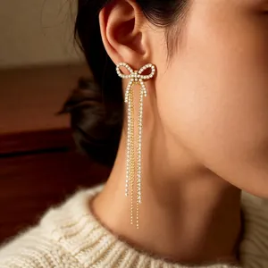 Elegant 18k gold plated bow tassel earrings with sparkling white cubic zirconia