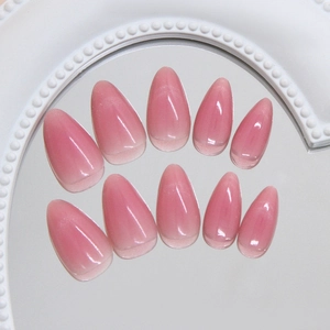 Sweet pink cat eye press-on nails with shimmering cat-eye effect in almond shape.