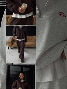 Detail of embroidered logo and zipper collar on vintage minimalist fleece tracksuit set