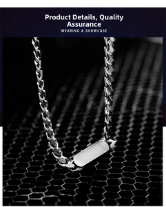 Macro shot of polished silver stainless steel Cuban chain with blank rectangle ID tag