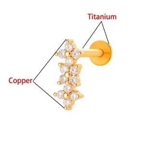 Gold titanium flower labret stud with copper flower top and clear zircon stones