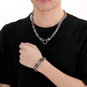 Men's gothic stainless steel skull necklace and bracelet set in vintage silver finish
