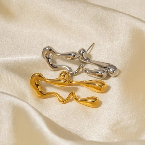 18k gold plated stainless steel irregular drop earrings on elegant satin fabric