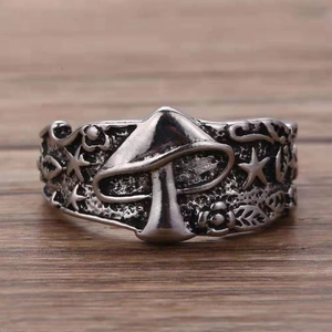 Vintage oxidized silver mushroom ring with stars and leaf carvings for a boho look