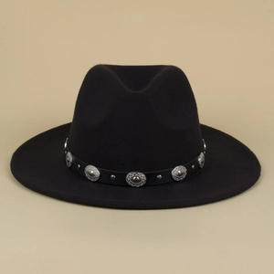 Close-up of black felt fedora hat with studded leather band and silver concho accents