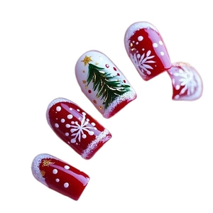 Christmas press-on nails set with red and white snowflake, star, and tree patterns