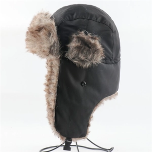Detailed view of winter trapper hat featuring faux fur lining and windproof black fabric