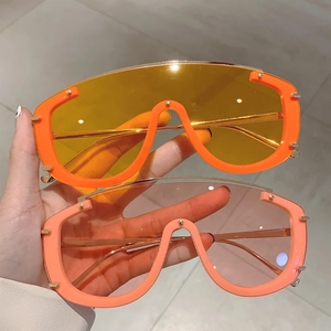 Modern oversized shield sunglasses in orange and pink frames with colorful lenses