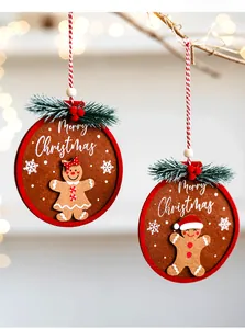 Felt gingerbread man ornaments with red polka dot dress and hat on Christmas tree