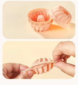 Detail showing the flexibility of food grade pink silicone cake mold for easy release