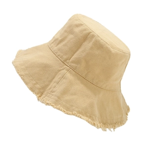 Modern frayed edge cotton bucket hat with a wide brim in soft light beige style