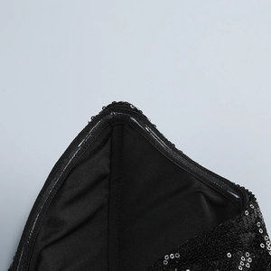 Detail of anti-slip silicone strip on black sequin deep V evening gown neckline