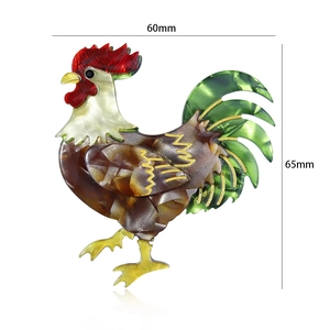 Detail showing acrylic rooster brooch dimensions of 60mm by 65mm on white background