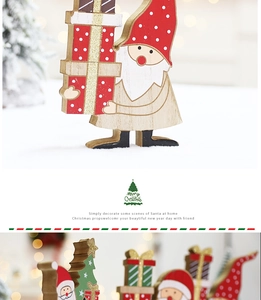 Close-up of wooden Christmas gnome ornament with red hat and natural wood grain detail