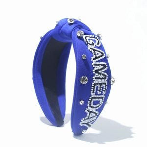 Royal blue knotted headband with GAMEDAY bead embroidery and sparkling rhinestones