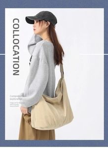 Model wearing a large beige corduroy crossbody tote bag for a minimalist casual look
