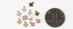 Detailed view of sparkling clover pendants in gold silver and rose gold for DIY jewelry