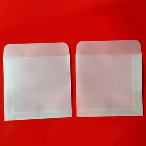 Detail of semi-transparent vellum envelopes with precise folded edges and flap closures