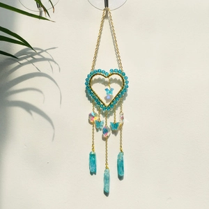 Golden heart suncatcher with blue crystal beads, butterfly charms and natural quartz points