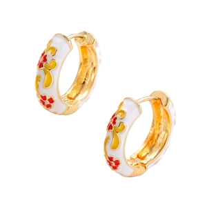 Detail of gold flower hoop earrings with white enamel and colorful floral pattern