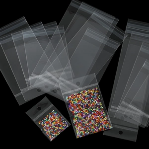 Detailed view of clear self-sealing OPP bags with colorful beads and hanging hole