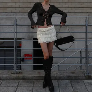 Chic black lace cardigan top with deep V-neck and ruffled lace skirt details