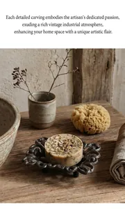 Detailed top view of a rustic cast iron soap holder with hollow floral patterns and organic soap
