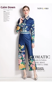 Detail of floral print satin set with elegant blue and white striped neckline and cuffs