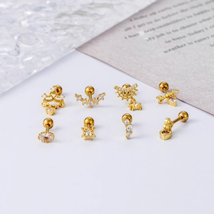 Set of 8 gold stainless steel cartilage earrings with heart and spider web zircon designs
